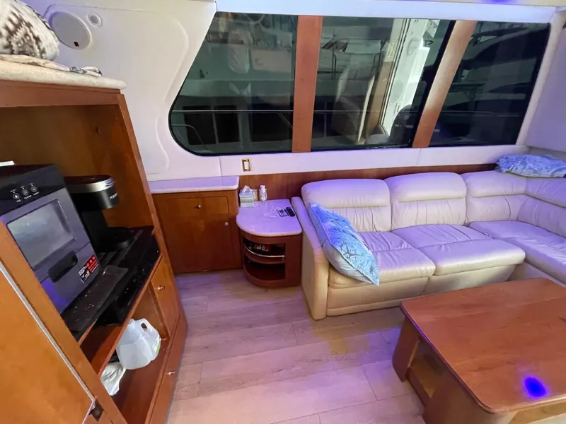 Slide: The Image of Interior of 1998 Carver 530 Voyager Pilothouse with leather seating and wooden cabinetry. - 29