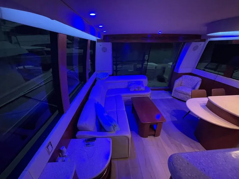 Slide: The Image of Luxurious interior of 1998 Carver 530 Voyager Pilothouse with ambient blue lighting. - 42