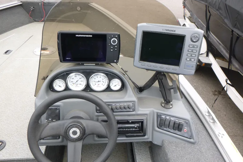 Slide: The Image of 2012 Lund 1775 Impact boat dashboard with Humminbird and Lowrance fish finders. - 14