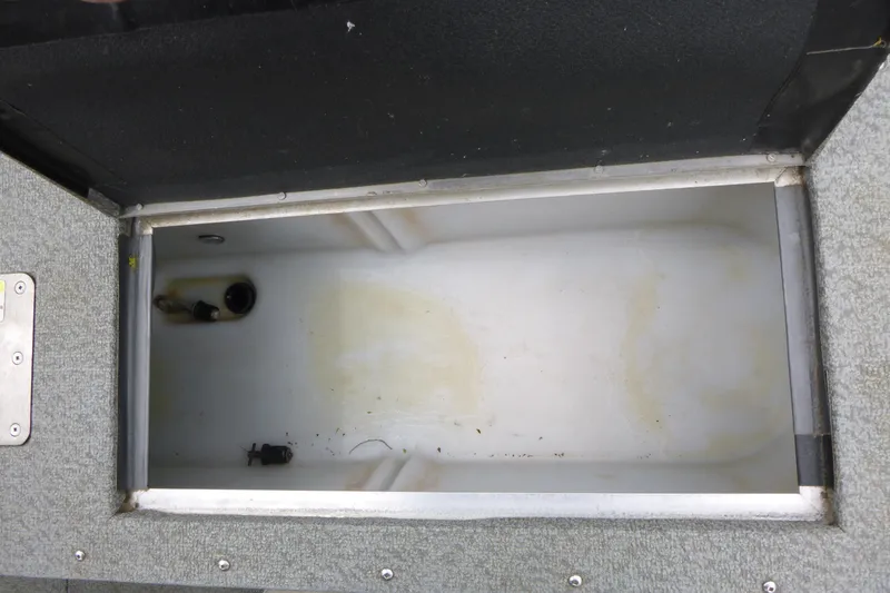Slide: The Image of Open storage compartment in a 2012 Lund 1775 Impact boat. - 15