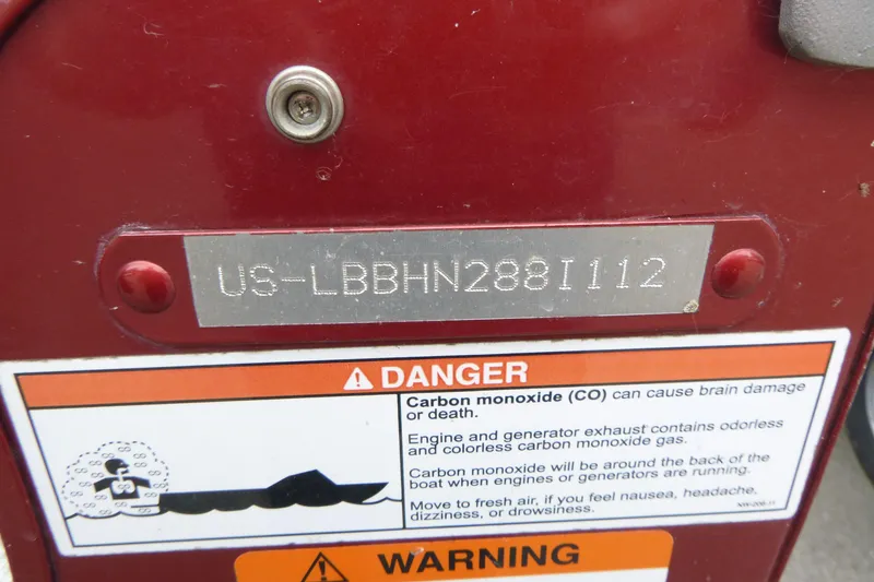 Slide: The Image of Close-up of a 2012 Lund 1775 Impact boat's identification plate and carbon monoxide warning label. - 18