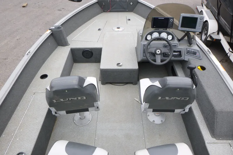 Slide: The Image of 2012 Lund 1775 Impact boat interior with steering console and seating. - 6