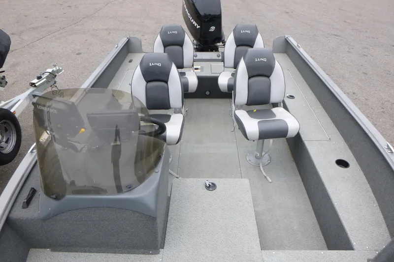 Slide: The Image of 2012 Lund 1775 Impact boat interior with four seats and steering console. - 7