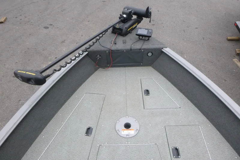 Slide: The Image of 2012 Lund 1775 Impact boat interior with trolling motor and storage compartments. - 8