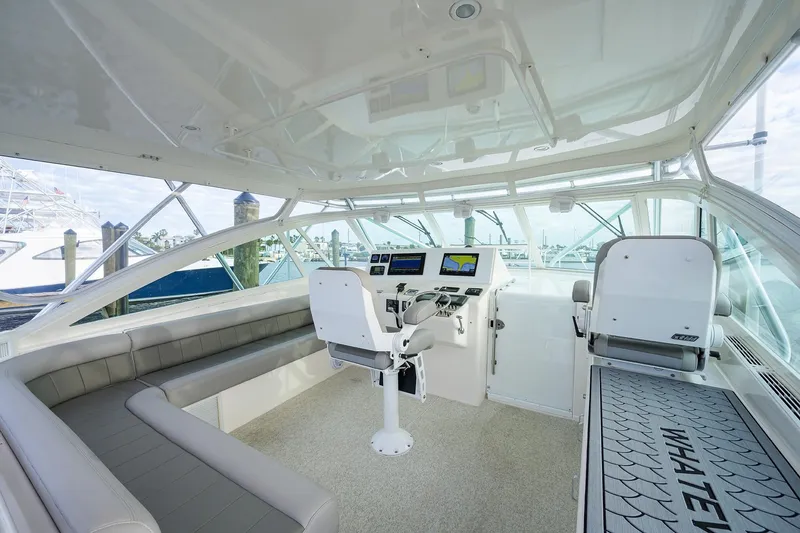 Slide: The Image of Interior of a 2005 Cabo Express yacht with helm station. - 12