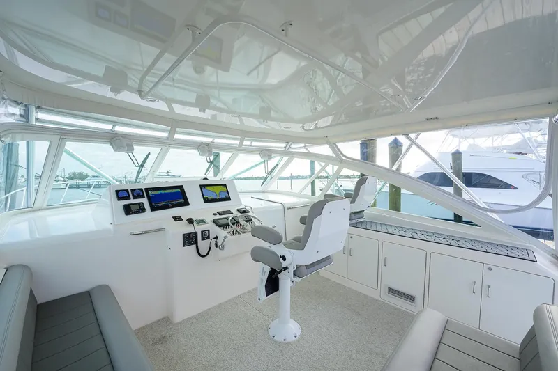 Slide: The Image of Interior of a 2005 Cabo Express yacht with helm station. - 13