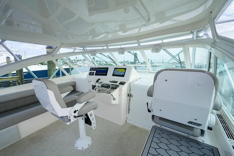 Slide: The Image of Interior of a 2005 Cabo Express yacht with helm station. - 15
