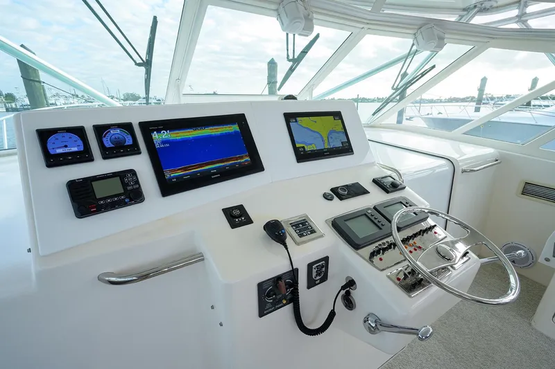 Slide: The Image of Helm of a 2005 Cabo Express yacht with modern electronics. - 18