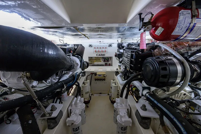 Slide: The Image of Engine room of a 2005 Cabo Express boat with CAT engines. - 33