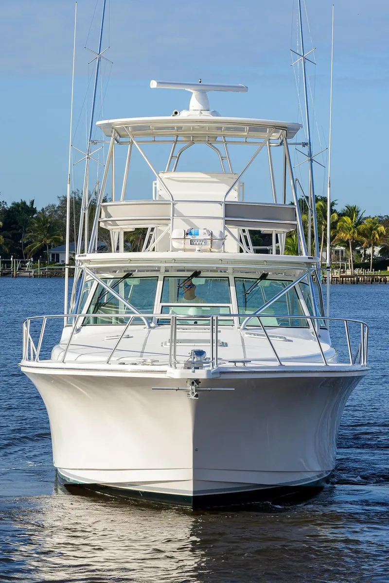 Slide: The Image of 2005 Cabo Express boat on calm water. - 44