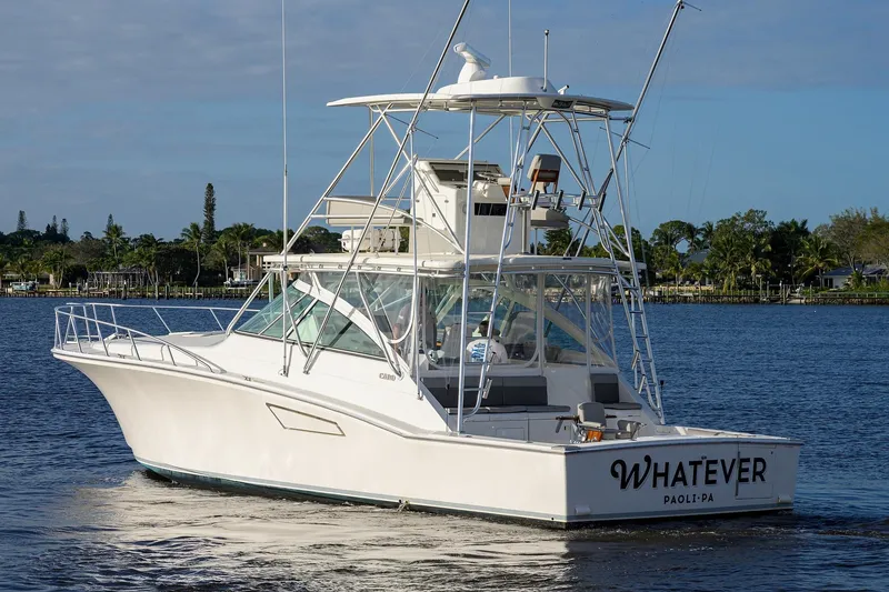 Slide: The Image of 2005 Cabo Express boat on calm water. - 47