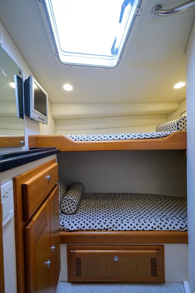 Slide: The Image of Interior of a 2005 Cabo Express with bunk beds. - 9