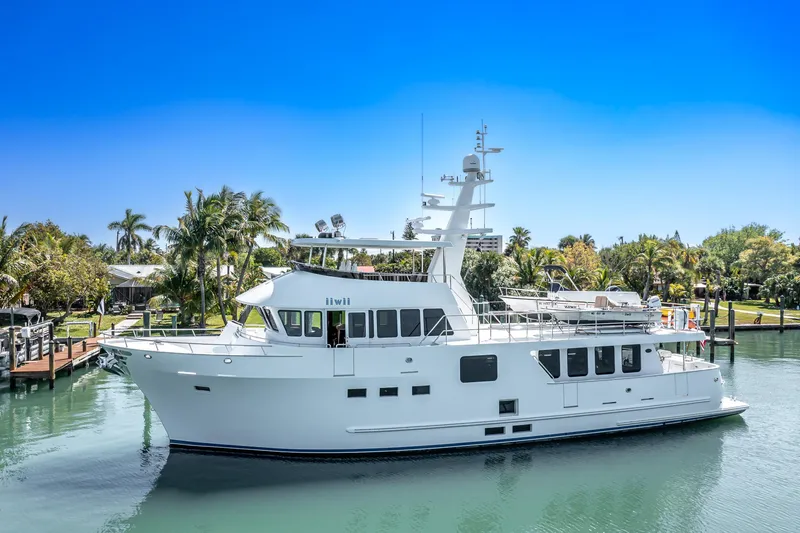 Slide: The Image of 2017 Northern Marine Expedition yacht docked in a tropical marina setting. - 1