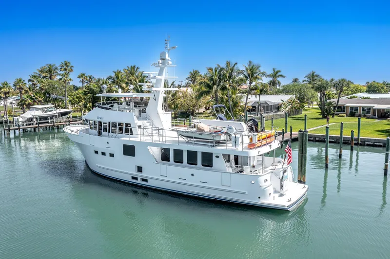 Slide: The Image of 2017 Northern Marine Expedition yacht docked in a tropical marina setting. - 3