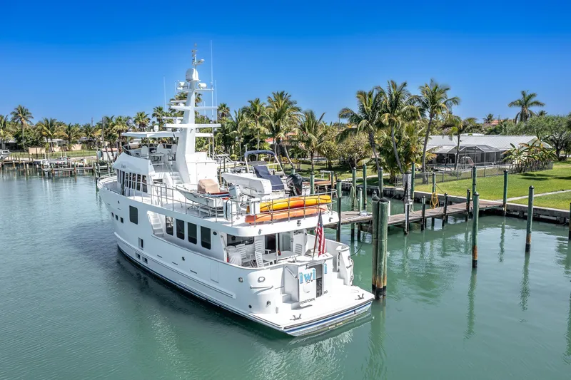Slide: The Image of 2017 Northern Marine Expedition yacht docked in a tropical marina setting. - 4