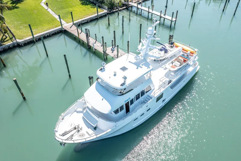 Slide: The Image of 2017 Northern Marine Expedition yacht docked in a serene marina setting. - 7