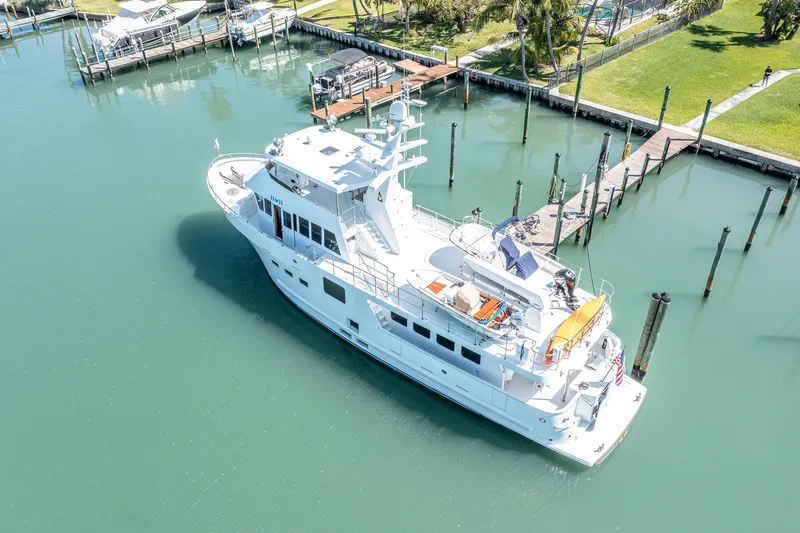 Slide: The Image of 2017 Northern Marine Expedition yacht docked in a serene marina setting. - 8