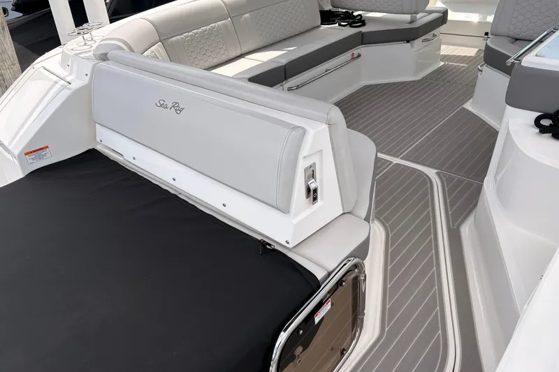 Slide: The Image of 2026 Sea Ray Sundancer 320 interior with sleek seating and modern design. - 7