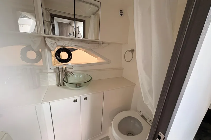 Slide: The Image of Modern bathroom in 2026 Sea Ray Sundancer 320 yacht with glass sink and toilet. - 16