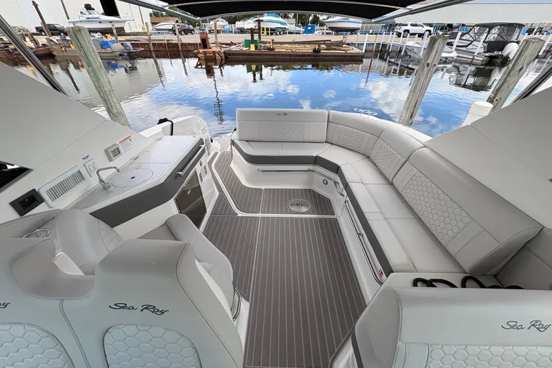Slide: The Image of Luxurious interior of 2026 Sea Ray Sundancer 320 yacht with elegant seating and kitchenette. - 12