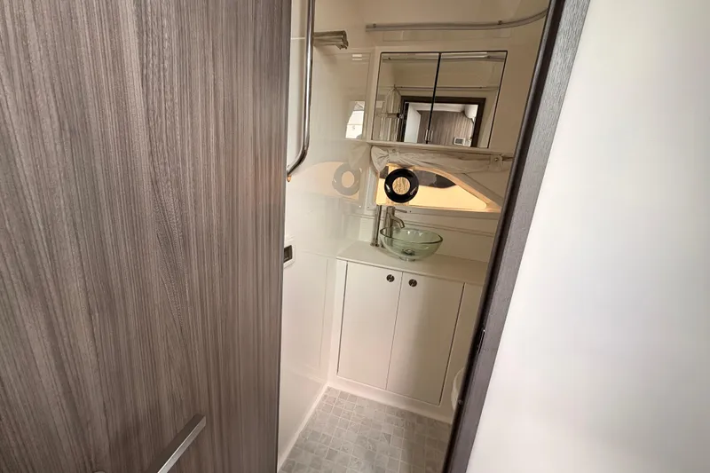 Slide: The Image of Modern bathroom interior of 2026 Sea Ray Sundancer 320 yacht, featuring sleek design elements. - 15