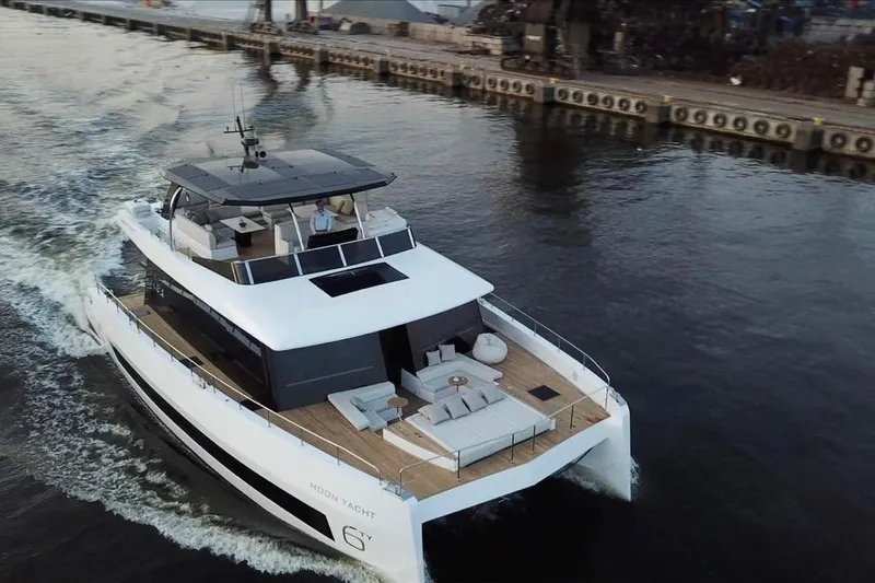 The Image of Luxurious 2025 Moon 60 yacht cruising in a serene harbor setting. - 1