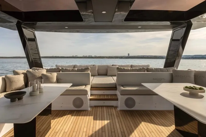 Slide: The Image of Luxurious 2025 Moon 60 yacht interior with elegant seating and ocean view. - 22