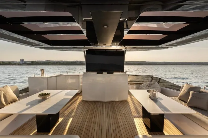 Slide: The Image of Luxurious 2025 Moon 60 yacht interior with elegant seating and scenic water view. - 23