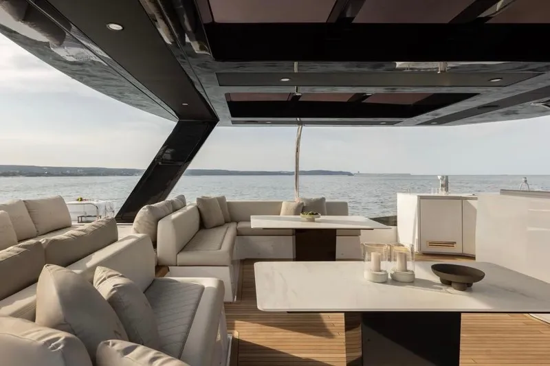 Slide: The Image of Luxurious Moon 60 yacht interior with elegant seating and ocean view, 2025 model. - 24