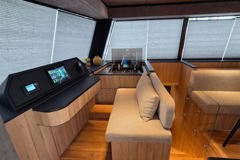 Slide: The Image of Modern interior of 2025 Moon 60 yacht with sleek control panel and cozy seating. - 34