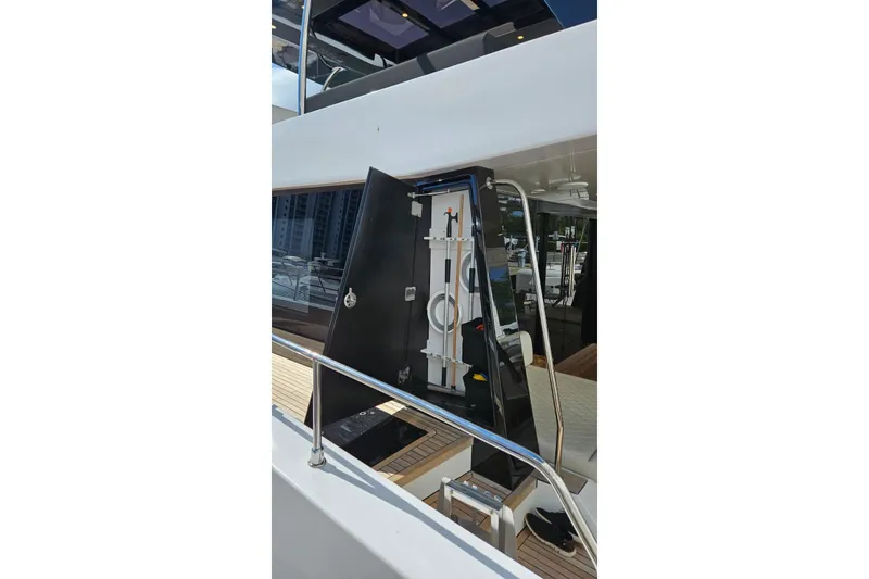 Slide: The Image of 2025 Moon 60 yacht with open storage compartment on deck. - 35
