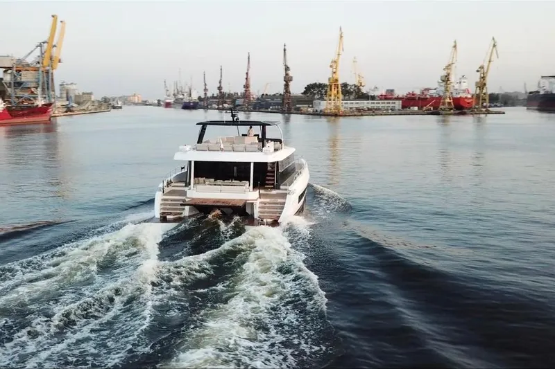 Slide: The Image of Luxury yacht "Moon 60" cruising in a bustling harbor, 2025 model. - 8