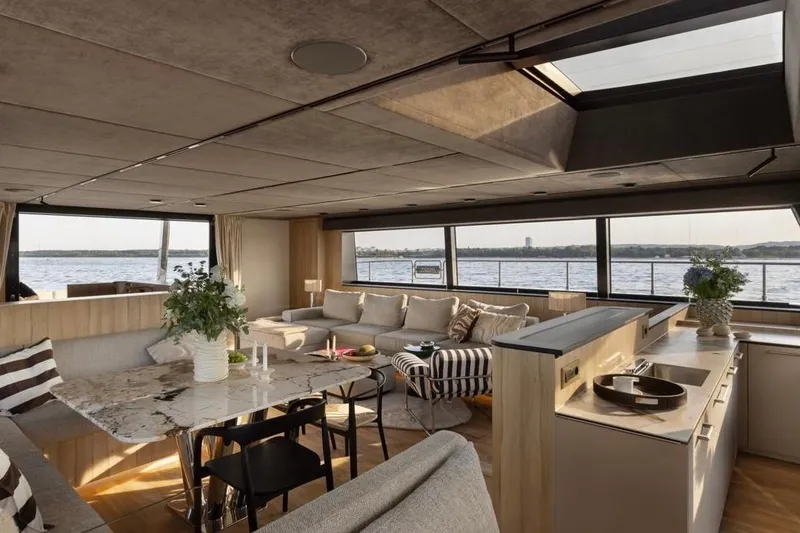 Slide: The Image of Luxurious interior of 2025 Moon 60 yacht with modern furnishings and panoramic windows. - 9