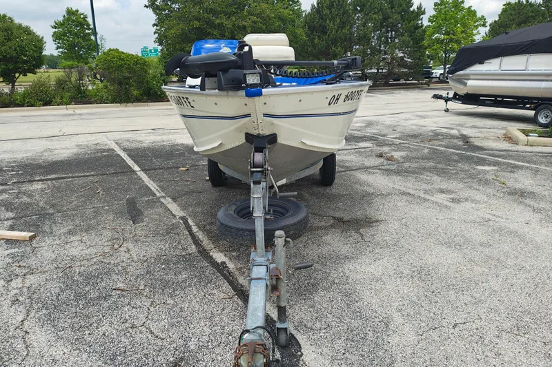 Slide: The Image of 1999 LOWE BOATS SEA NYMPH V-148SC on trailer in parking lot. - 1