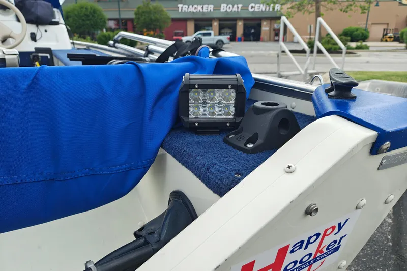 Slide: The Image of 1999 LOWE BOATS SEA NYMPH V-148SC with blue cover and LED light, near Tracker Boat Center. - 14