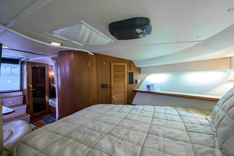 Slide: The Image of Luxurious cabin interior of 2004 Pursuit 3800 Express yacht with cozy bedding. - 36