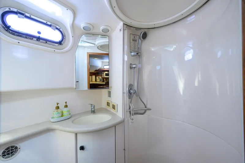 Slide: The Image of Luxurious bathroom in 2004 Pursuit 3800 Express yacht with shower and sink. - 40