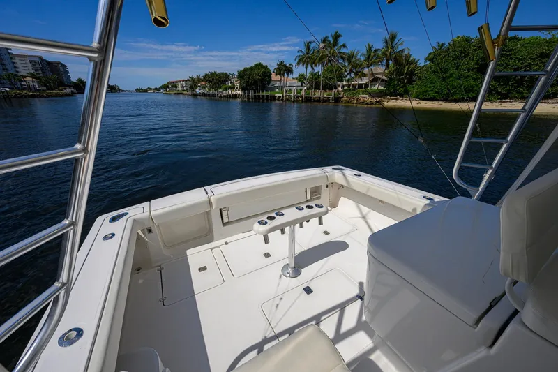 Slide: The Image of 2004 Pursuit 3800 Express boat deck with scenic waterfront view. - 43