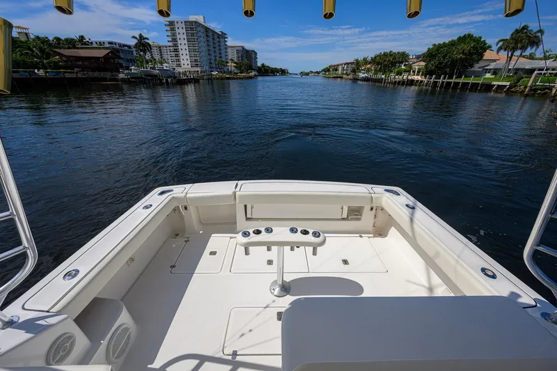 Slide: The Image of 2004 Pursuit 3800 Express boat deck overlooking a scenic waterway. - 44