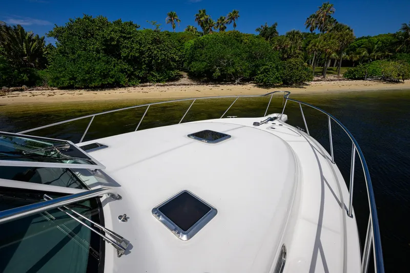 Slide: The Image of Bow view of 2004 Pursuit 3800 Express yacht near tropical shoreline. - 64