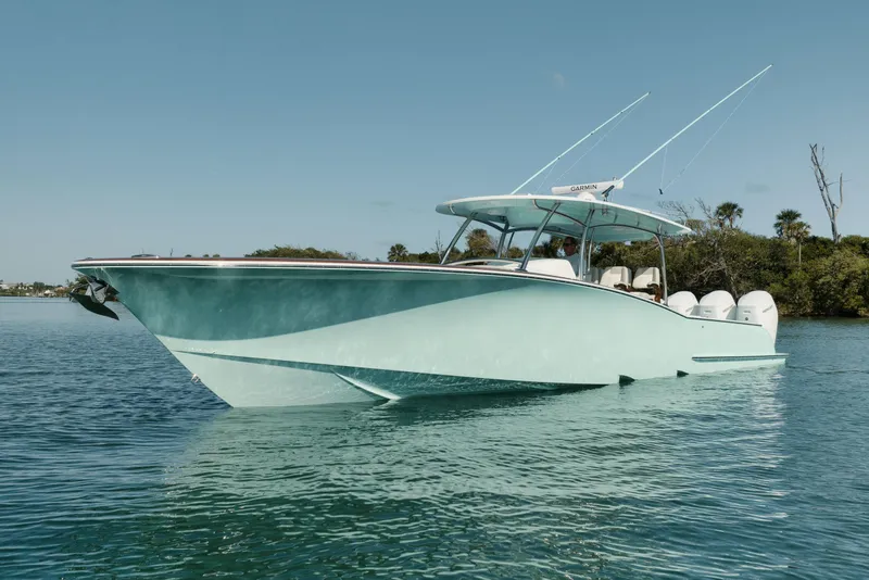 Slide: The Image of Manufacturer Provided Image: 2025 Mag Bay 43 CC boat on calm water, featuring sleek design and modern amenities. - 1
