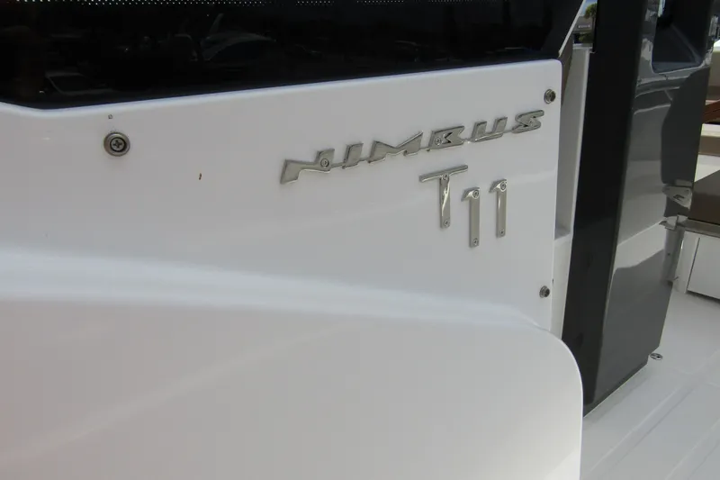 Slide: The Image of 2025 Nimbus Tender 11 boat, sleek white exterior with model nameplate. - 11