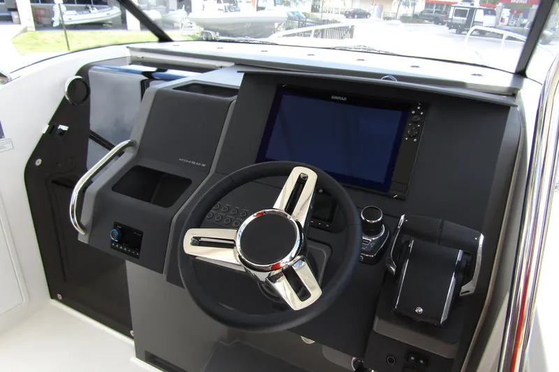Slide: The Image of Cockpit of 2025 Nimbus Tender 11 with modern steering and navigation system. - 14