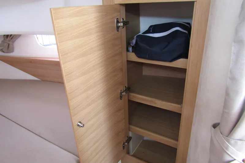Slide: The Image of Wooden cabinet with shelves inside Nimbus Tender 11, 2025 model, featuring a bag. - 25