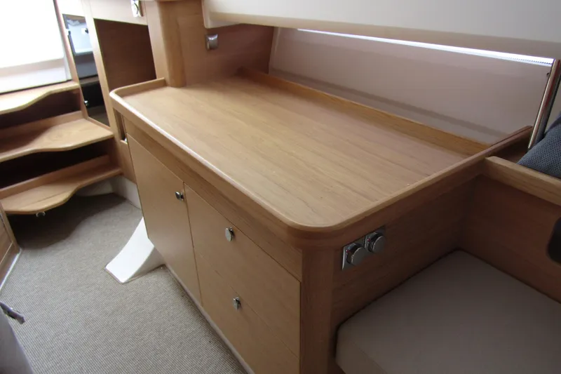 Slide: The Image of Interior of 2025 Nimbus Tender 11, featuring sleek wooden cabinetry and modern design. - 26