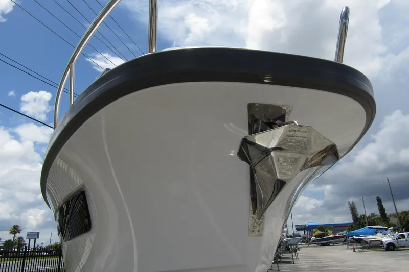 Slide: The Image of 2025 Nimbus Tender 11 boat with stainless steel anchor, under a cloudy sky. - 4