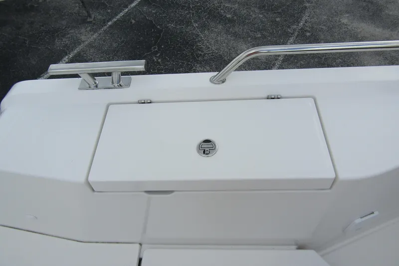 Slide: The Image of 2025 Nimbus Tender 11 boat deck with storage compartment and stainless steel railing. - 43
