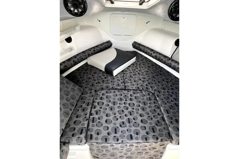 Slide: The Image of Interior cabin of 2021 Campion A21 boat with patterned seating and speakers. - 11