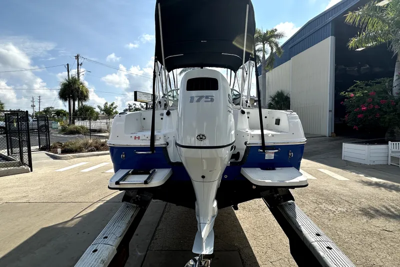 Slide: The Image of 2021 Campion A21 boat on trailer, rear view, sunny day, outdoor setting. - 5
