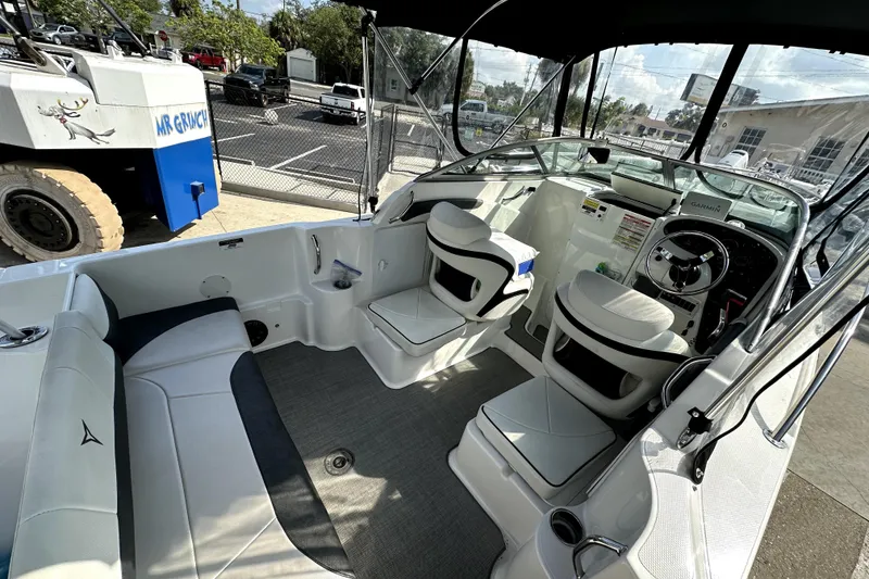 Slide: The Image of Interior of a 2021 Campion A21 boat with seating and steering console. - 7